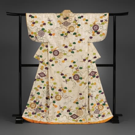 Over robe (uchikake) with Genji wheels and wild ginger leaves. Edo period (1615–1868), early 19th century. Figured satinweave silk (rinzu) with silk embroidery and couched gold thread. 68 x 46 1/4 in. (172.7 x 117.5 cm). John C. Weber Collection. Image © 