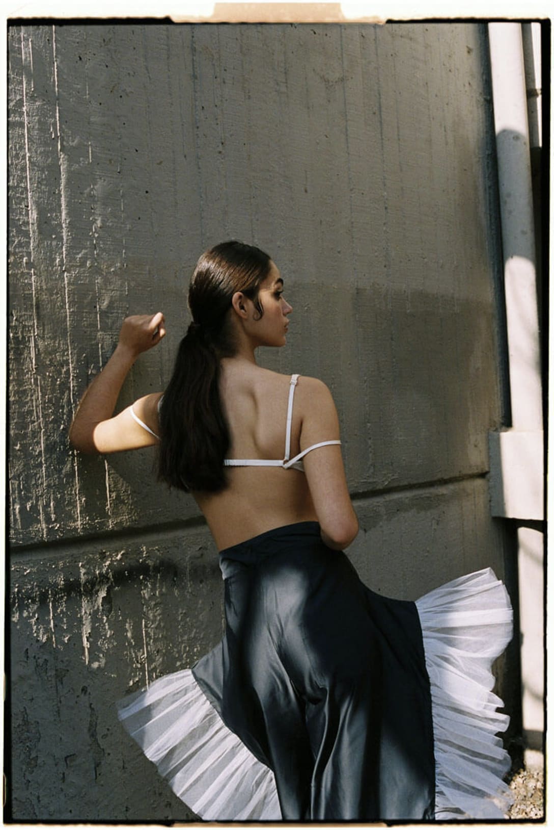 top by JACQUEMUS, trousers by PETER SPOSITO STUDIO