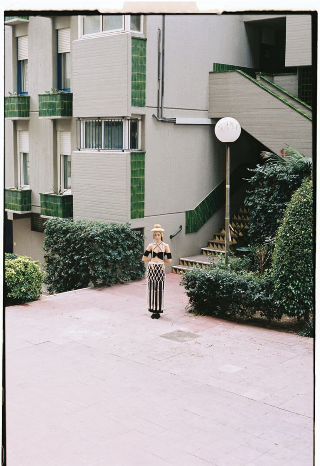 top by JACQUEMUS, skirt by DELATORRE, trousers by ARMANI, shoes by ZARA, hat by PARDOHATS × FIGTREE