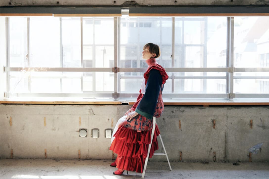 dress and tights by ATSUSHI NAKASHIMA, shoes by CHARLOTTE OLYMPIA, earrings by JOUETE